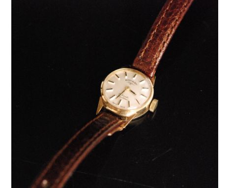 A 9ct ladies Rotary manual wind wrist watch, circular ivory dial with gilt baton markers, 17 jewel incabloc movement to a pla