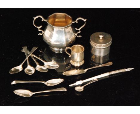 A small parcel lot of assorted hallmarked silver items to include six tea spoons, a sugar basin, a miniature tankard, a small