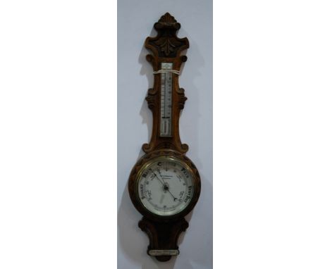 A Victorain carved oak aneroid barometer by Curtis Horspool Leicester, S/D, height 90cm