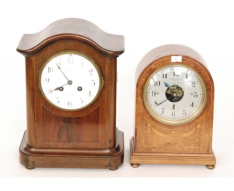 A 20th Century French walnut Bulle mantle clock, with a battery operated movement and a silvered circular dial, height 26cm, 