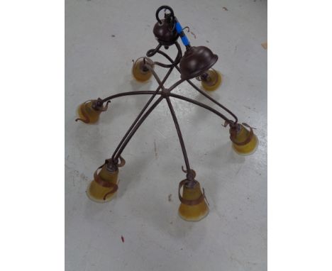 A contemporary metal six way light fitting with glass shades 