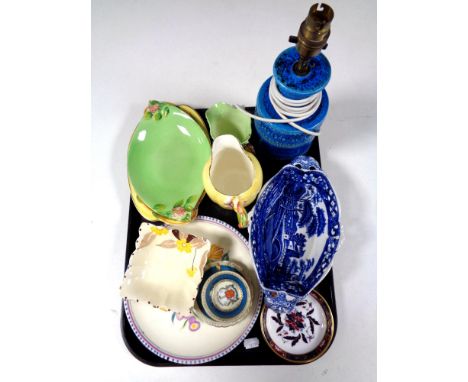 A tray containing assorted china to include a 20th century pottery table lamp, Royal Winton milk jugs and dishes, Poole plate