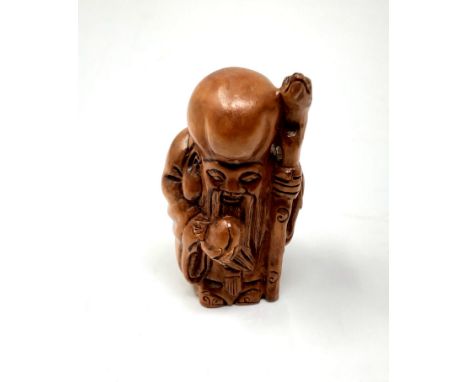A carved Chinese hardwood netsuke - Elderly Gentleman with staff