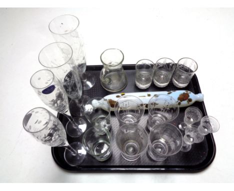 A tray containing an antique opaque glass rolling pin together with assorted drinking glasses to include a pair of Royal Doul