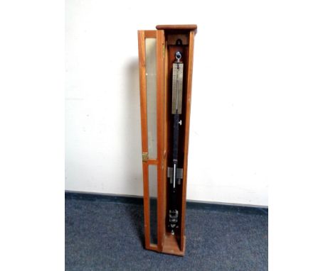 A stick barometer by F Darton &amp; Company Ltd in fitted cabinet 