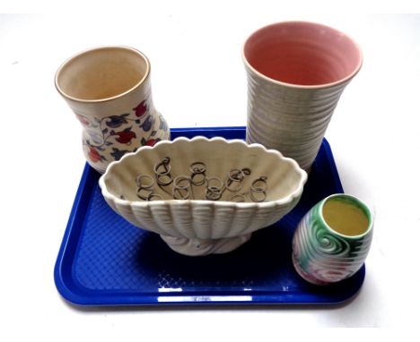 A tray containing a Poole Pottery ribbed vase together with three further vases, Ducal and two Sylvac 