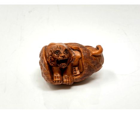 A carved Chinese hardwood netsuke - Tiger in corn husk