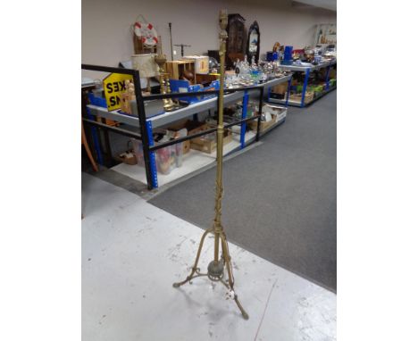 An Arts &amp; Crafts brass floor lamp  