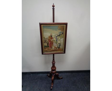 A Victorian mahogany tapestry pole screen 