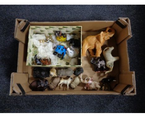 A box of a quantity of elephant and pug ornaments to include glass and ceramic examples, together with a Beswick figure of a 