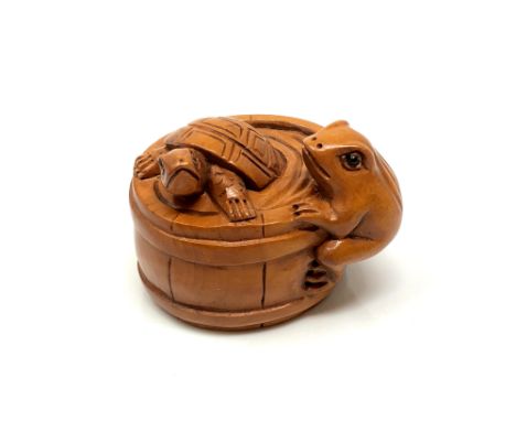 A carved Chinese hardwood netsuke - Tortoise and frog in barrel