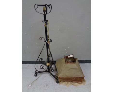 An antique wrought iron rise and fall oil lamp stand (converted to electric) with a vintage standard lamp shade (as found)  