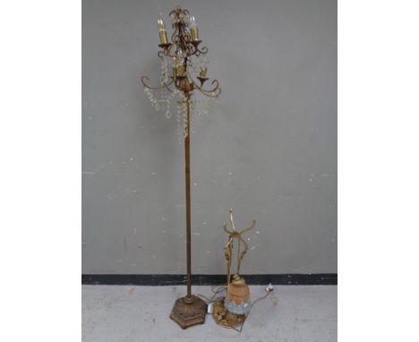 A gilt metal six way floor lamp with glass drops together with an antique gilt metal hanging light fitting with glass shade  