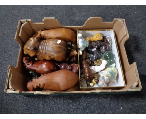 A box of a quantity of hippopotamus ornaments to include wooden glass and ceramic examples 