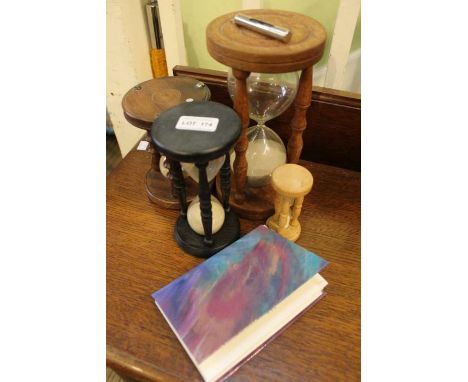 Five various sand timers to include a nurses minute timer, and a selection of postcards appertaining to the telling of time&n