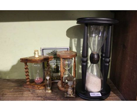 Five various sand timers, and a sundial plaque&nbsp;