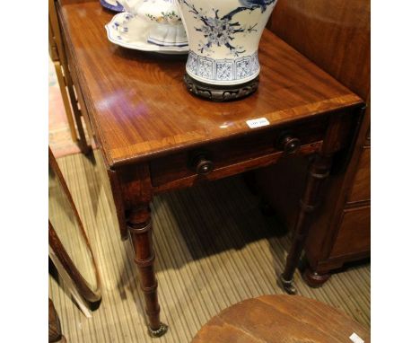 A 19th century mahogany crossbanded Pembroke table, with single cutlery drawer and opposing dummy, on four ring turned legs a