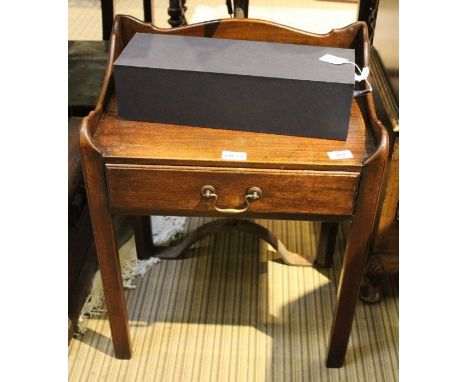 A mahogany lamp table with three-quarter upstand top over single drawer