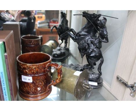 A late Victorian ebonised figure of a warrior on a rearing horse 30cm tall, together with a treacle glazed hunting tankard an