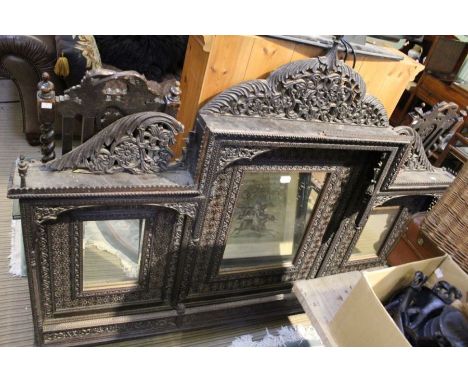 A heavily carved probably Indian triple plate wall mirror, dimensions are 132h x 184w x 14deep