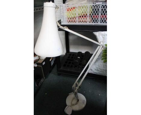 A white modern Anglepoise lamp