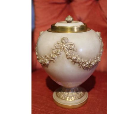 A Royal Worcester blush &amp; gilt lidded vessel with floral swags