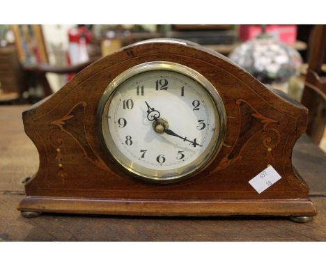 A mahogany inlaid mantel clock