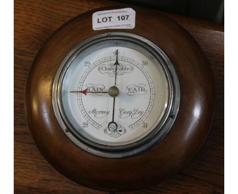 A small wall mountable barometer