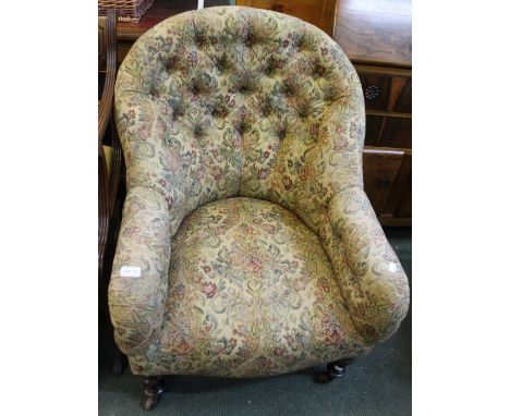 A Victorian upholstered button back armchair, having show wood legs &amp; ceramic castors (recently reupholstered)