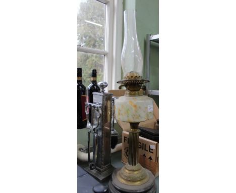 An Art Deco chromed companion set, together with the base of an oil lamp