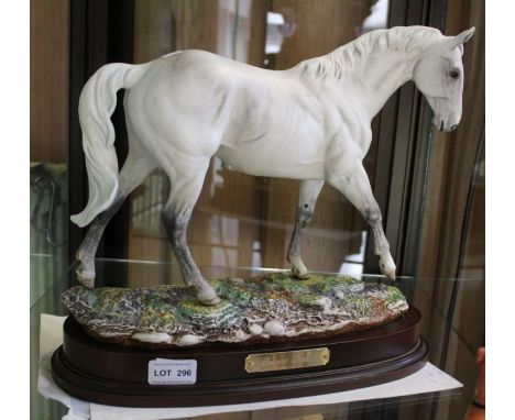 A Royal Doulton ceramic "Desert Orchid" racehorse on stand with paperwork