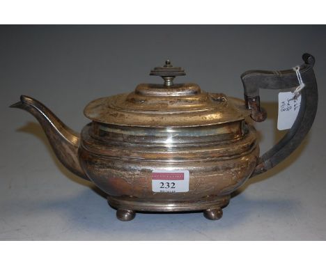 An early 20th century Mappin & Webb silver lidded teapot having ebonised angular handle and finial of squat bellied form, gro