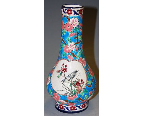 A circa 1900 Longwy crackle glazed pottery vase of lower bulbous form, having typical bright coloured floral enamelled decora