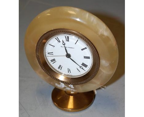 A 20th century onyx and brass mounted mantel clock, the circular enamel dial with Roman numerals signed Matthew Norman, heigh