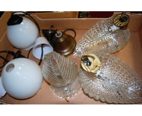 A pair of moulded clear glass wall lights; together with further lighting