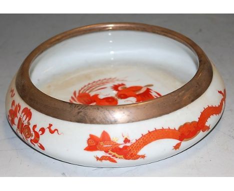 A 20th century Meissen glazed ceramic shallow circular table bowl having a silver rim marked 925, dia. 17cm