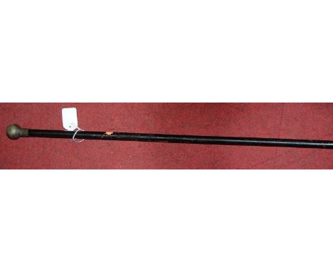 An early 20th century ebonised swagger stick