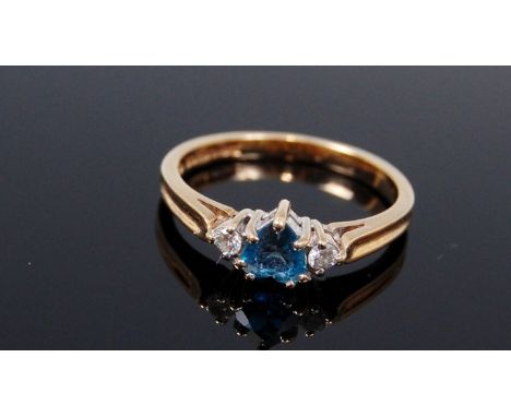 A modern 9ct gold, blue topaz and diamond set ring, 1.9g, size K