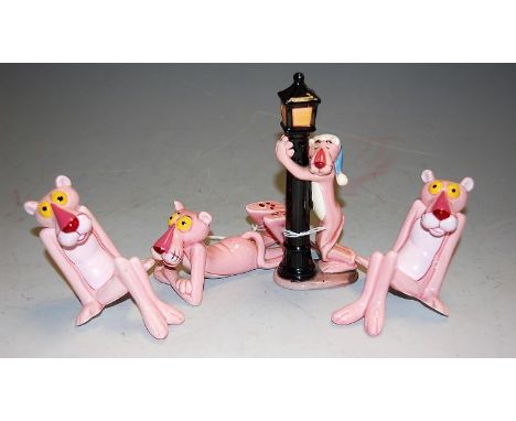 Four various glazed ceramic models of the Pink Panther in various poses