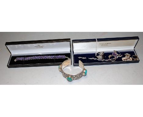 A collection of silver and paste set jewellery to include; five dress rings, two bracelets, and a white metal bangle (7)