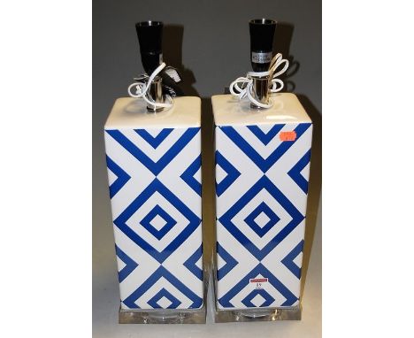 A pair of contemporary glazed ceramic and lucite by Savavieh Lighting