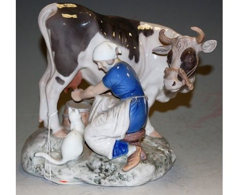 A Bing & Grondahl glazed ceramic figure group of a seated lady milking a cow modelled by Axel Locher, printed backstamps vers