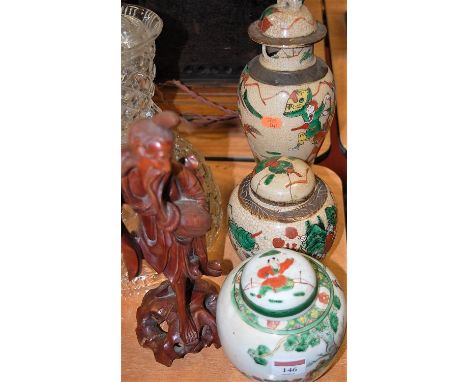 Two Chinese enamel and crackle glazed stoneware vases and covers, together with a similar ginger jar and cover (3)