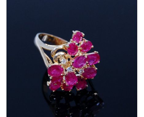 A contemporary 14ct gold ruby and diamond point set cluster ring 5.2g, size N