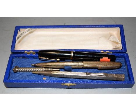 An early 20th century Yard-o-lead engine turned silver propelling pencil, together with two other silver propelling pencils, 