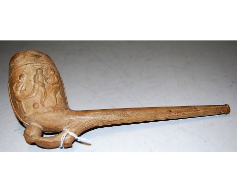 A Victorian clay pipe the bowl having carved sporting scenes