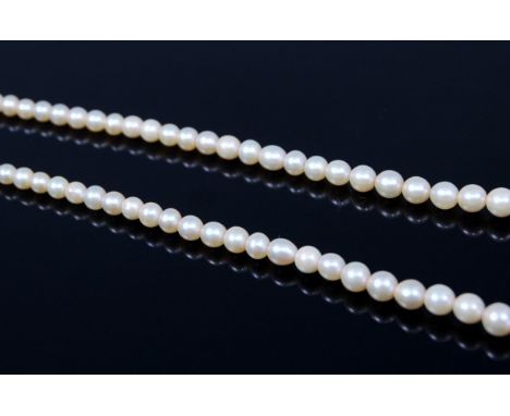 A cultured and graduated pearl single string necklace, having 9ct white gold and diamond point set clasp, 46cm