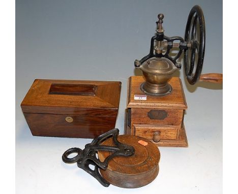 A table top coffee grinder, together with a wheel pulley and a Victorian rosewood hinge top tea caddy (3)