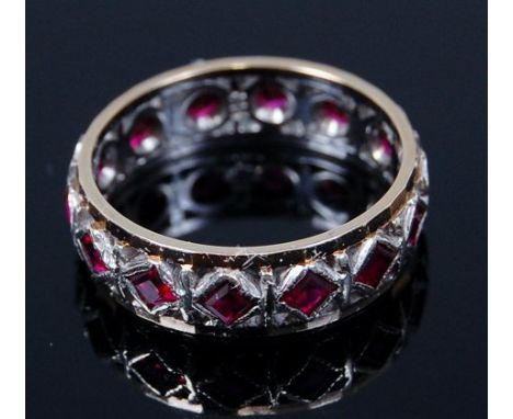 A 9ct gold ruby set eternity ring, 2.8g, size K/L