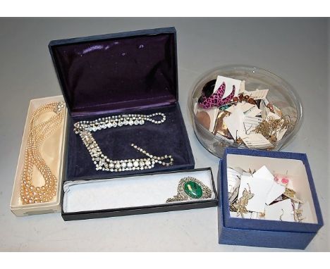 A mixed lot of mainly contemporary costume jewellery to include faux pearl necklaces, various bangle, brooches, ear pendants,